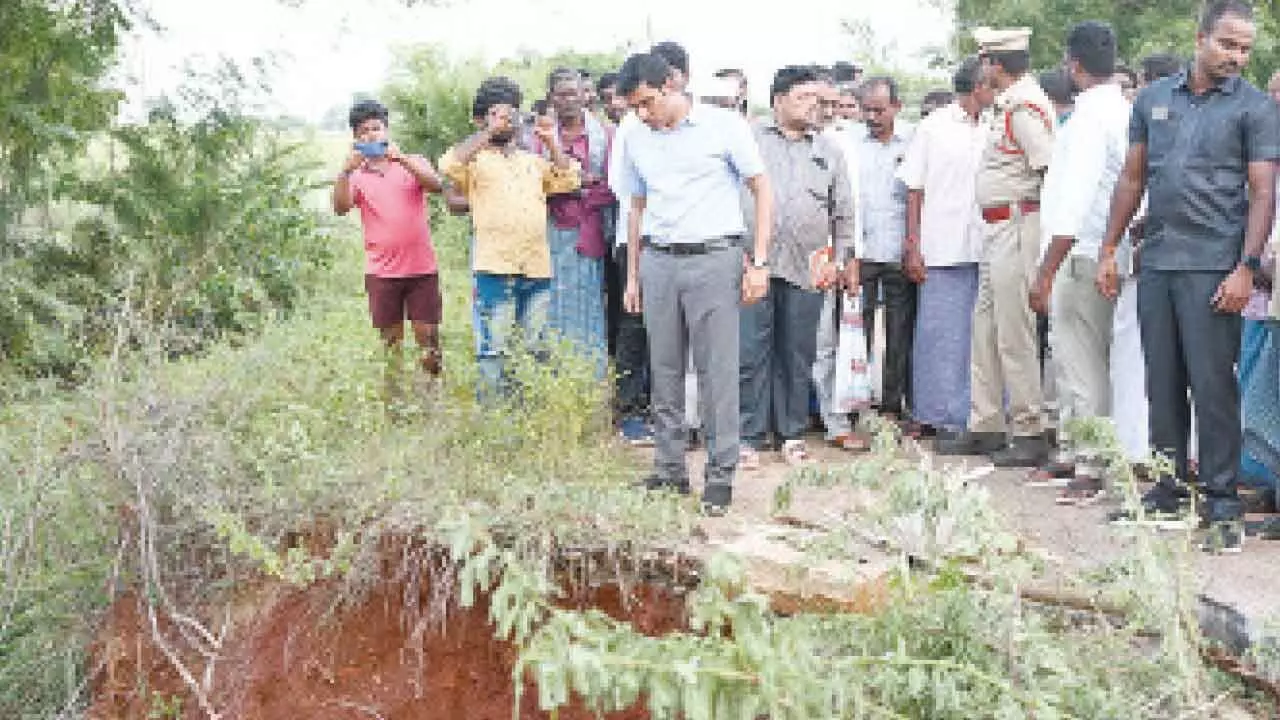 District Collector Dr S Venkateswar inspecting the damaged pipe culvert in Venkatagiri mandal on Thursday