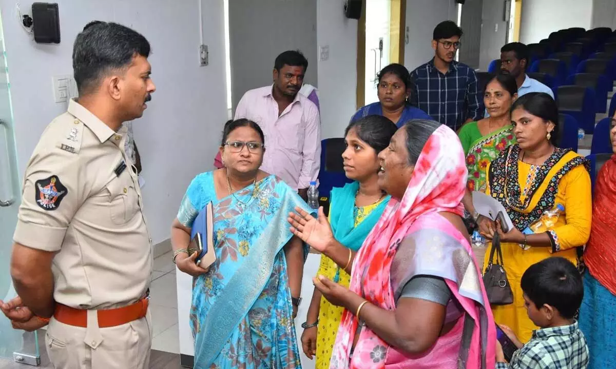 SP V Harshavardhan Raju interacting with the family members of police, who died in line of duty,  in Kadapa on Friday