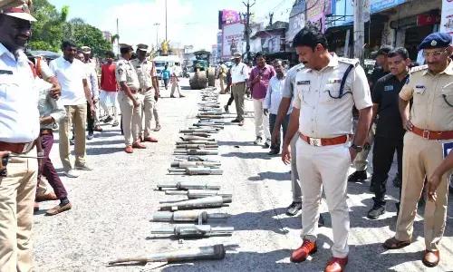 Prakasam SP A R Damodar inspecting the seized modified silencers of motorbikes in Ongole on Friday