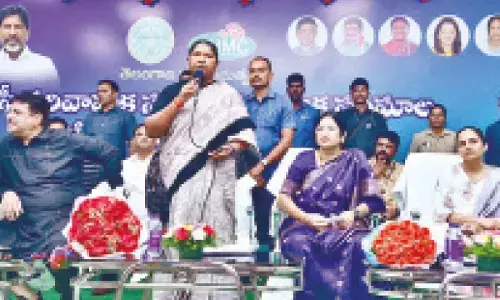 Seethakka hands over loan aid to SHGs under Musi rehab prog