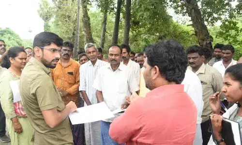 District Collector O Anand interacting with the farmers at Ankupalle village on Friday