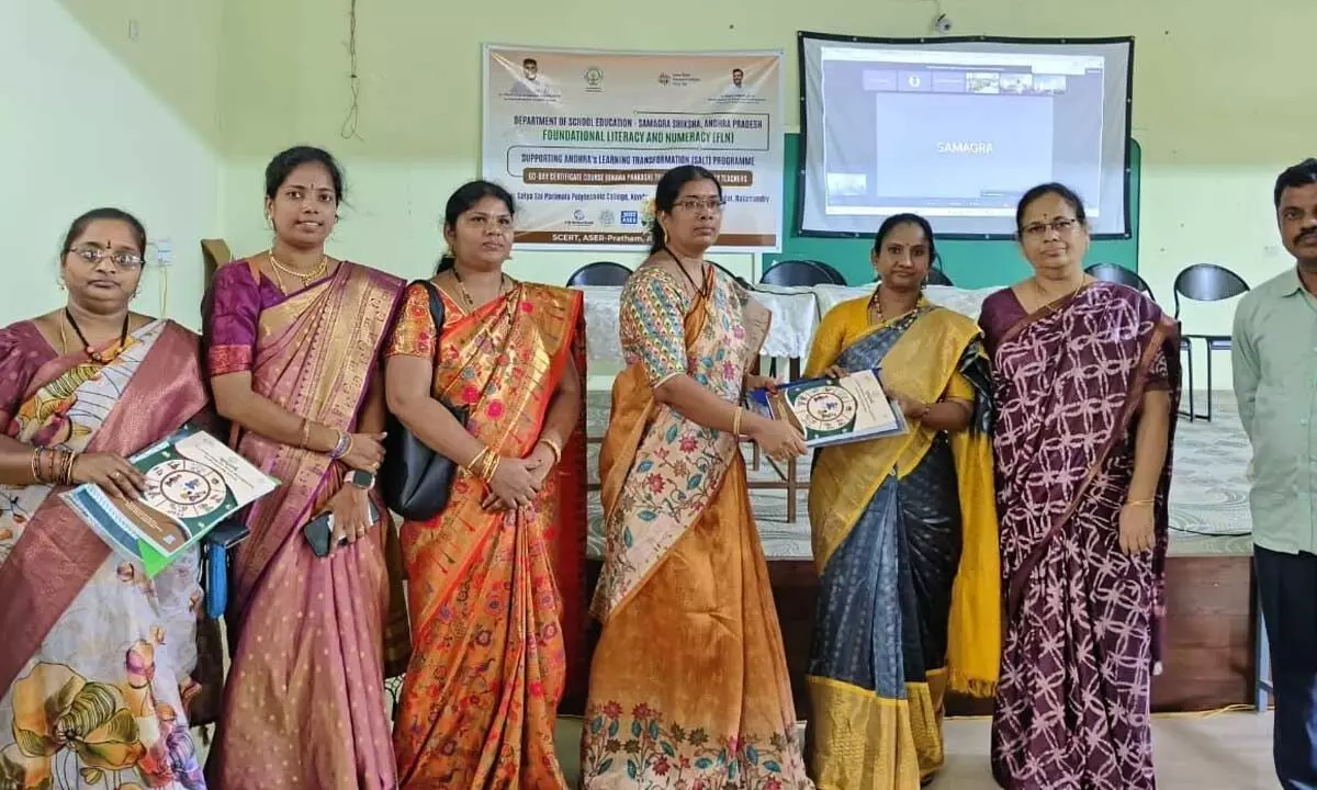 Additional Project Coordinator of the Samagra Shiksha Abhiyan (SSA) handing over training module kits to teachers at a training programme for primary teachers