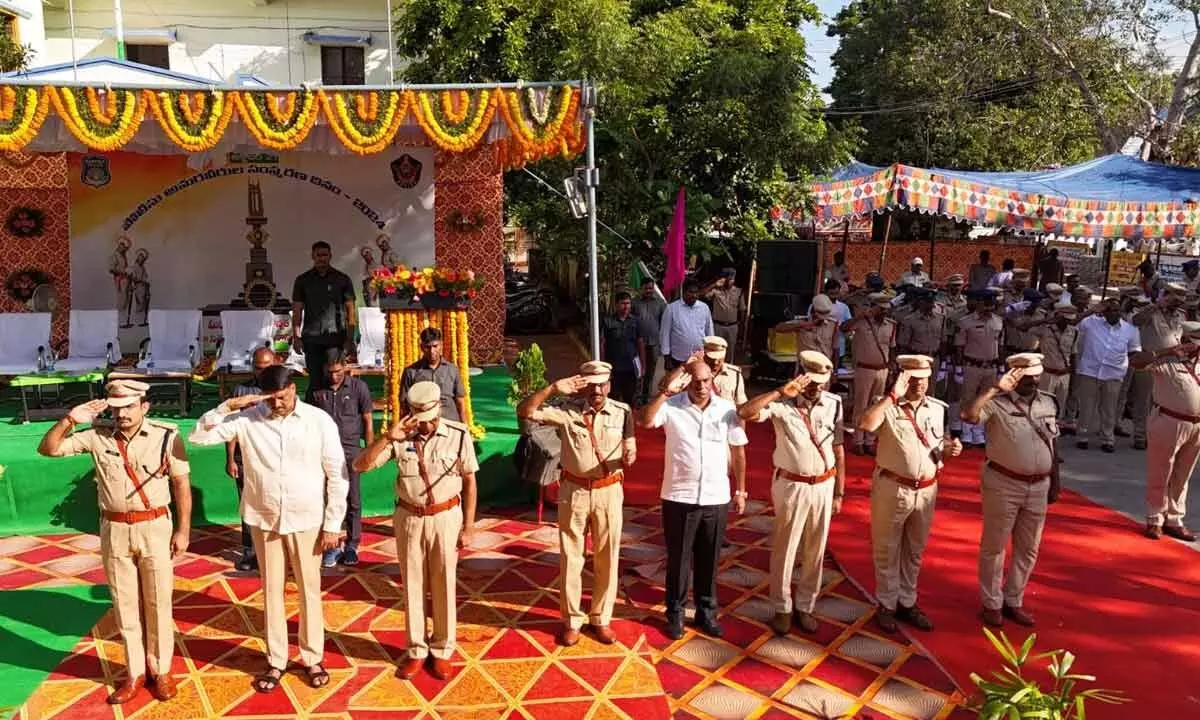 Bapatla SP tushar Dudi, MLA Vegesna Narendra Varma Raju and others paying tributes to police martyrs at Bapatla on Monday