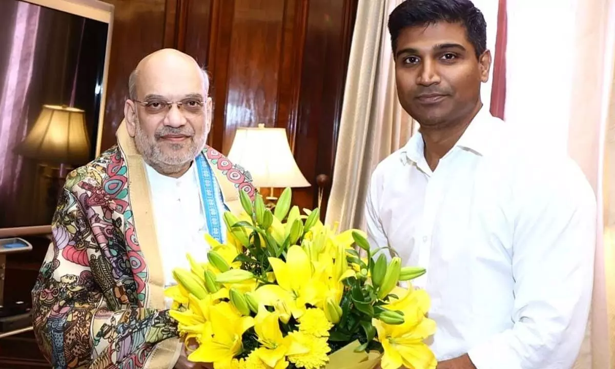 MP Lavu Sri Krishnadevarayalu presenting a flower bouquet to the Union Minister of Home Affairs Amit Shah in Delhi on Monday