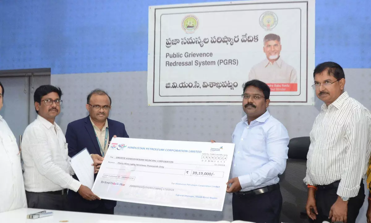 GVMC Commissioner P Sampath Kumar receiving a cheque from HPCL regional manager B Ravikanth in Visakhapatnam on Monday