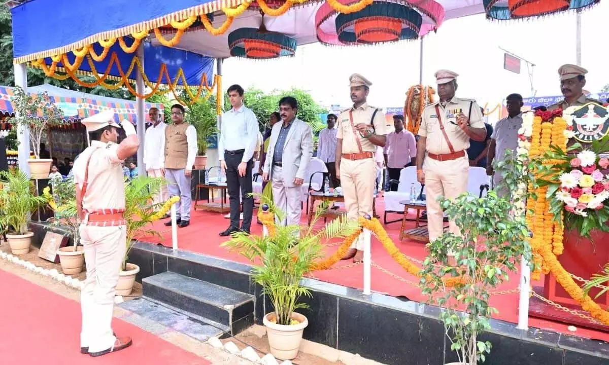 Chittoor district judge E Bhima Rao, Collector Sumit Kumar and SP Manikanta Chandolu taking salute during the Police Commemoration Day event on Monday