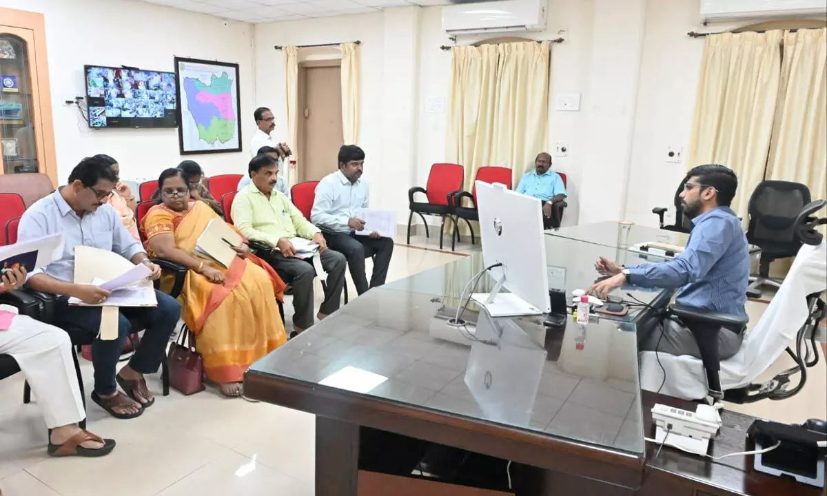 Collector O Anand holding a meeting with agriculture officials in Nellore on Tuesday