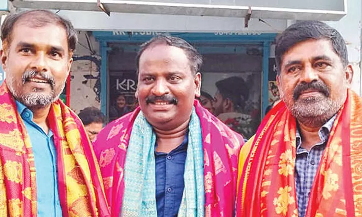 New president of Tirupati Press Club R Murali with secretary P Balachandra (left) and treasurer G Chandra Babu (right)