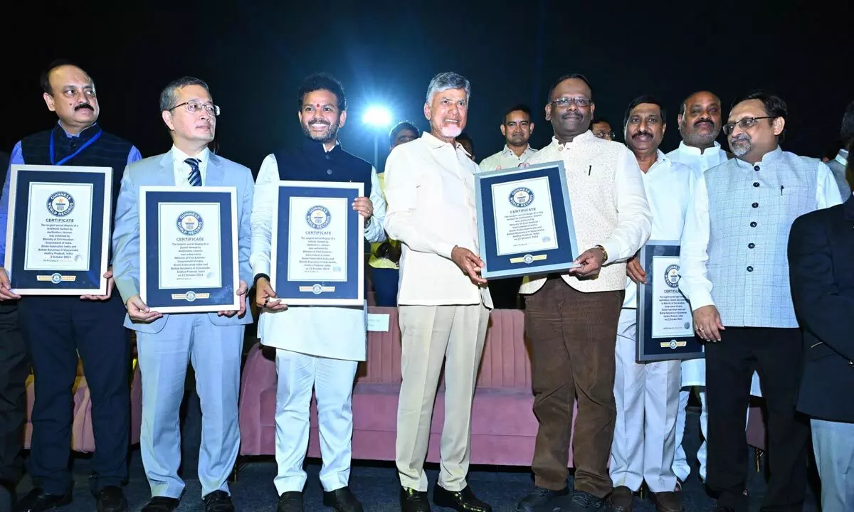 Representatives of Guinness Book of World Records hand over certificates of five records to Chief Minister N Chandrababu Naidu and civil aviation minister K Ram Mohan Naidu