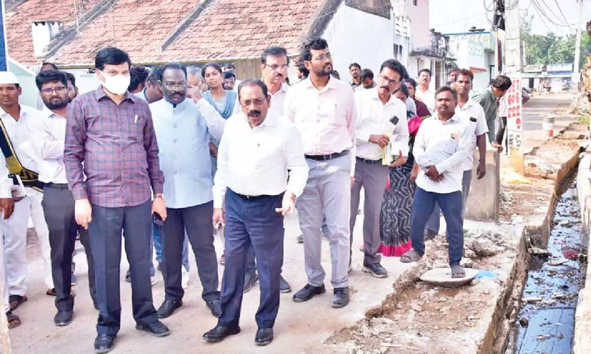 Senior IAS officer K Vijayanand inspecting sanitation and water supply system as part of his enquiry into causes of diarrhoea outbreak in Gurla on Tuesday