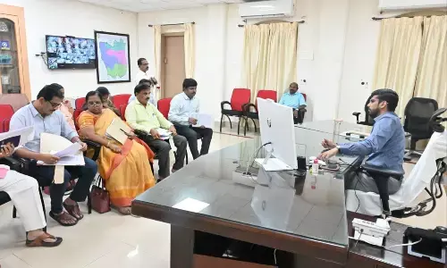 Collector O Anand holding a meeting with agriculture officials in Nellore on Tuesday