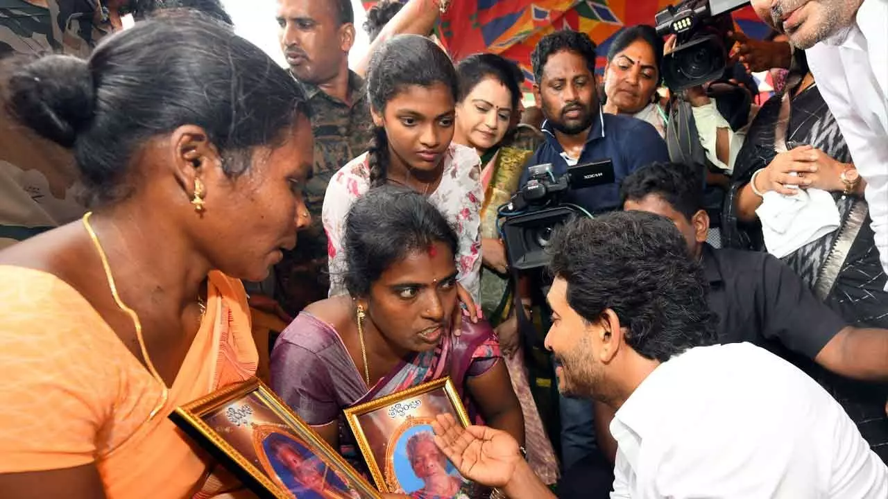 YSRCP president Y S Jagan Mohan Reddy speaks to the families of those died of diarrhoea at Gurla in Vizianagaram district on Thursday