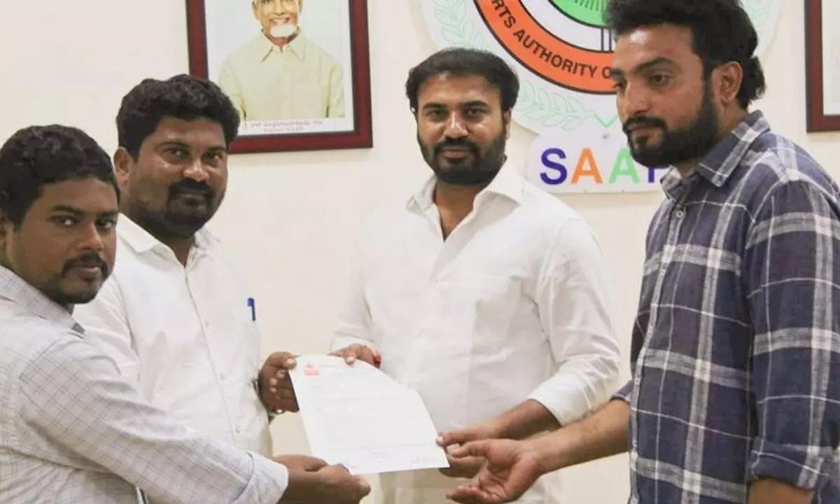 DYFI leaders Y Ramu and G Ramanna submitting a  representation to Animini Ravi Naidu, chairman of Sports  Authority Andhra Pradesh, in Vijayawada on Friday