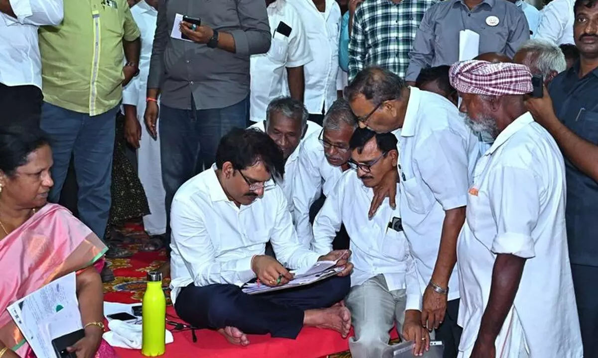 Parchuru MLA Yeluri Sambasiva Rao receiving petitions from people at the Praja Darbar held at his camp office in Isukadarsi village on Friday