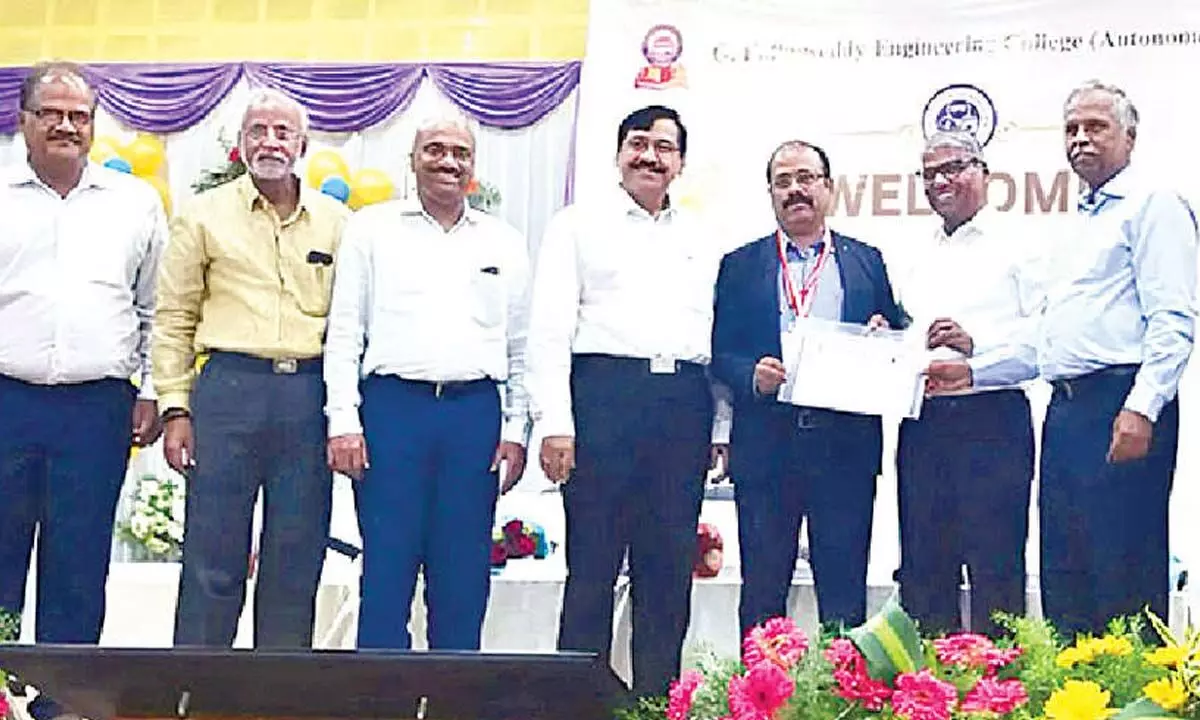 JNTU Anantapur Vice-Chancellor Prof Sudarshan Rao presenting the award to MITS Principal Dr C Yuvaraj at a programme at G Pulla Reddy Engineering College in Kurnool on Friday