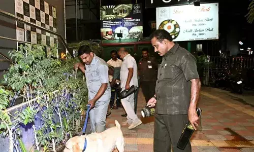 Police conduct thorough inspections at a hotel following bomb threat in Tirupati