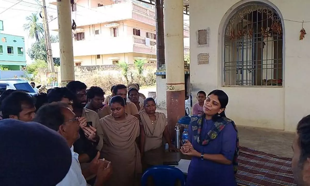 Collector P Prashanti interacting with local residents during her visit to Gummalladoddi village amidst ongoing protests against the Assago Industry