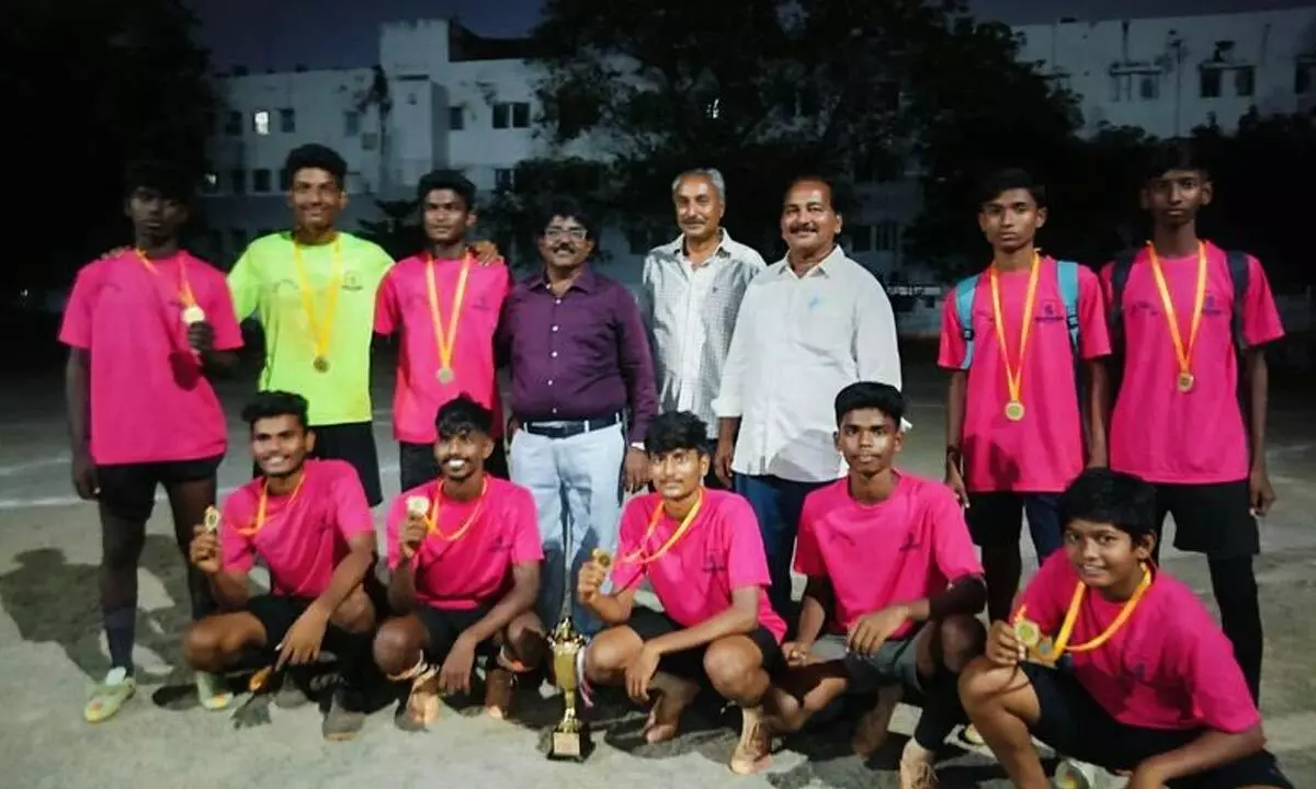 Winning team with trophy