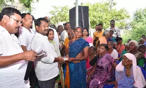 Social Welfare Minister Dr DSBV Swamy distributing pensions to beneficiaries at Karumanchi village in Kondapi constituency on Friday