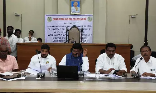 GMC Commissioner Puli Srinivasulu addressing the stakeholders meeting at the GMC office in Guntur on Friday. Mayor Kavati Siva Naga Manohar Naidu is also seen.