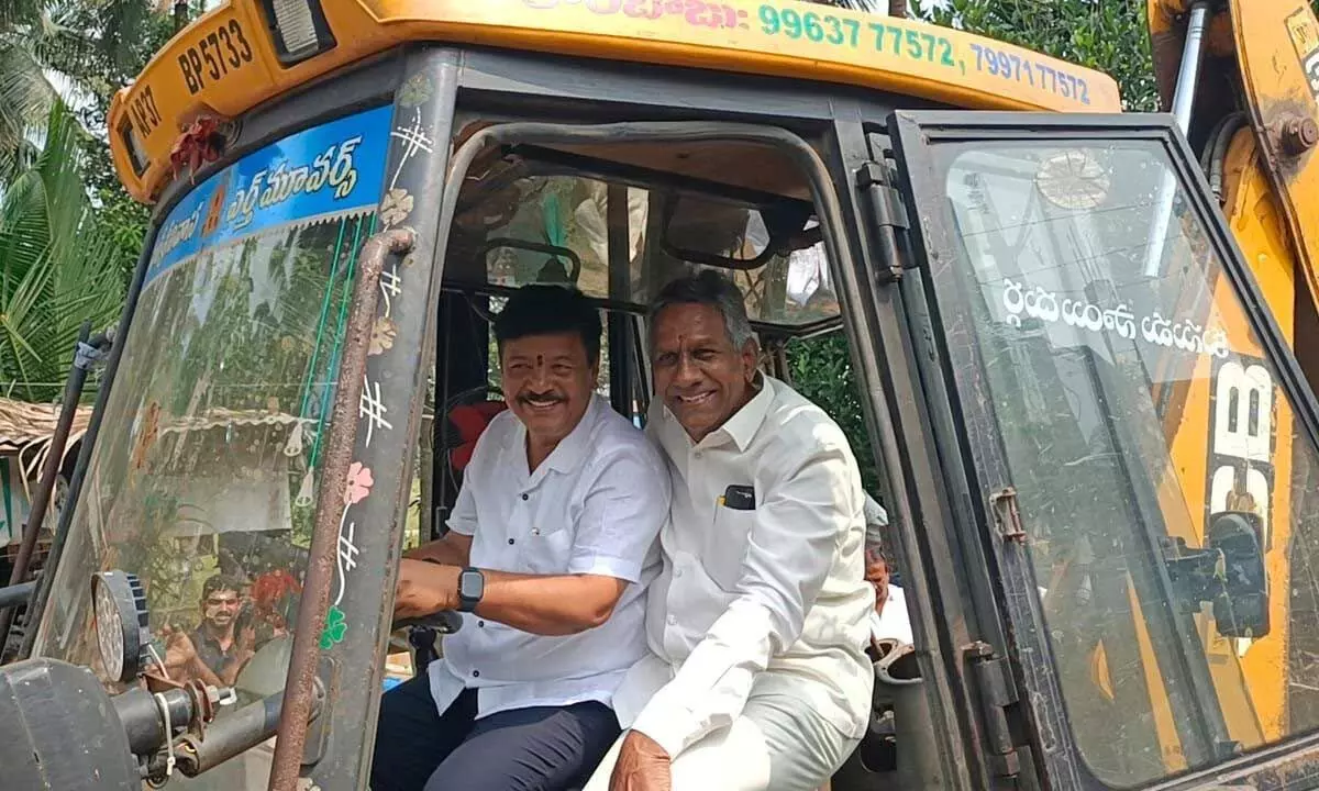 Minister Kandula Durgesh, along with former MLA Burugupalli Sesha Rao, inaugurating the pothole-filling work on roads at Mukkamala village of Nidavavolu constituency on Sunday