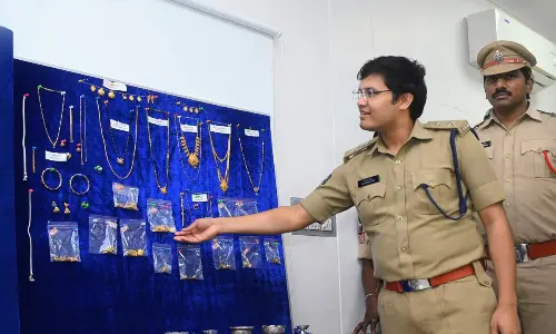 Eluru District Superintendent of Police K Prathap Siva Kishore showing the recovered property in Eluru on Sunday