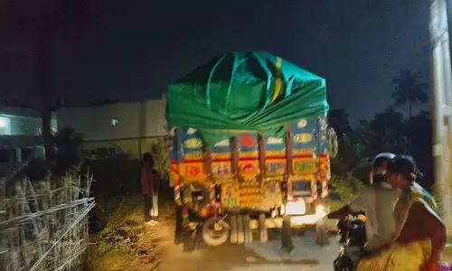 Heavy load of sand being shifted in a lorry during night hours from the Dusi sand reach in Srikakulam to Visakhapatnam