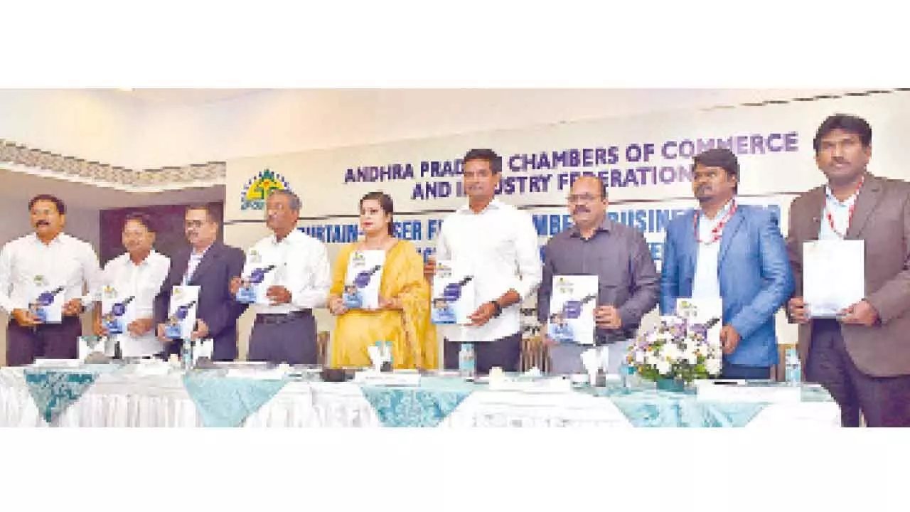 Minister for MSMEs Kondapalli Srinivas and CEO of AP MSME Development Corporation Nandani Salaria releasing a brochure along with AP Chamber of Commerce president Potluri Bhaskara Rao and other members for AP Chambers Business EXPO-2024 to be held this month-end in Vijayawada on Tuesday Photo: Ch Venkata Mastan