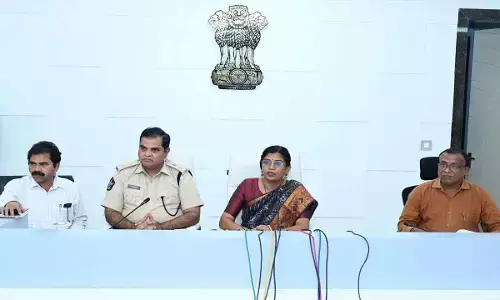 Collector P Prasanthi addressing the media at the Collector’s Camp Office on Tuesday. SP D Narasimha Kishore, joint collector S Chinna Ramudu, and District Revenue Officer T Sriramachandra Murthy are present