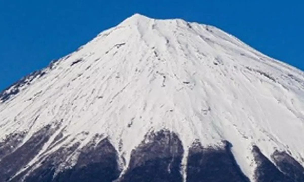 Mount Fuji observes seasons first snowcap, latest ever in 130 years