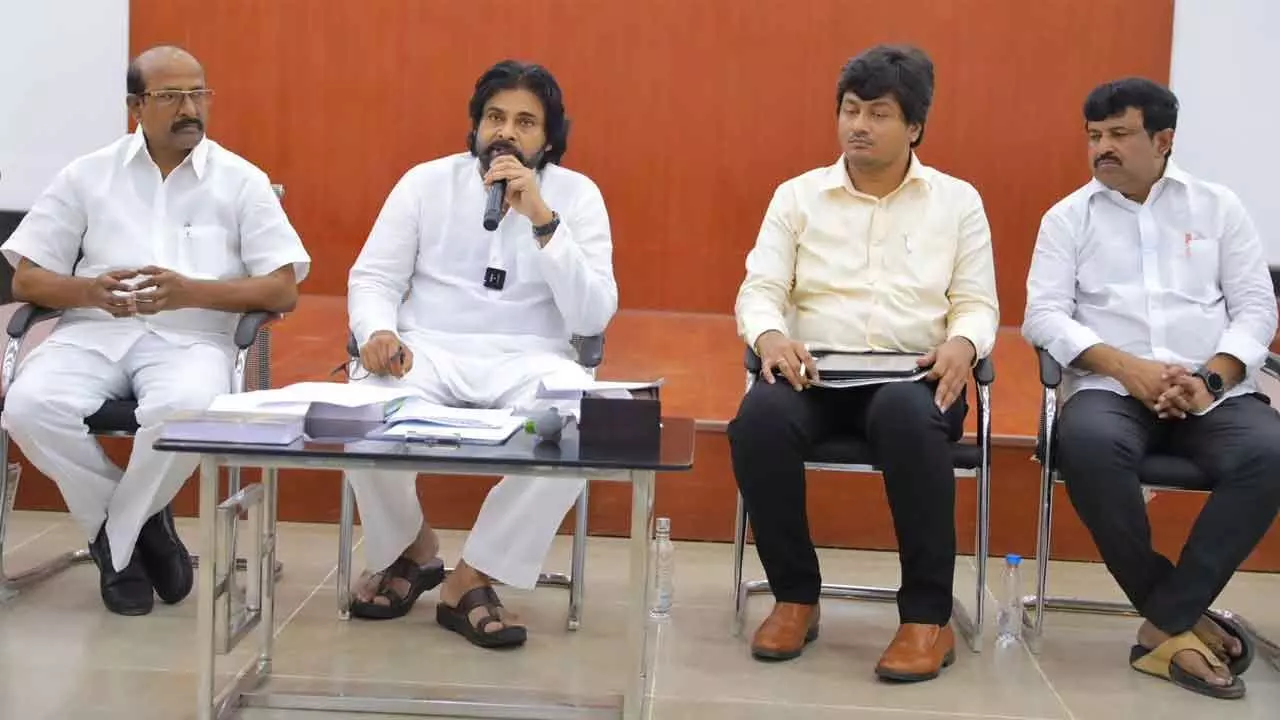 Deputy Chief Minister Pawan Kalyan flanked by Panchayat Raj Chambers honorary president Y V B Rajendra Prasad, commissioner of Panchayat Raj Krishna Teja and MLC Pidugu Hariprasad addressing the village sarpanches and the local body representatives at the camp office in Mangalagiri on Thursday