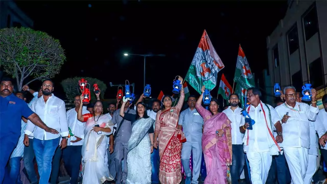 Congress leaders led by APCC chief Y S Sharmila taking out a protest rally holding lanterns against increase in power tariff  in Vijayawada on Thursday