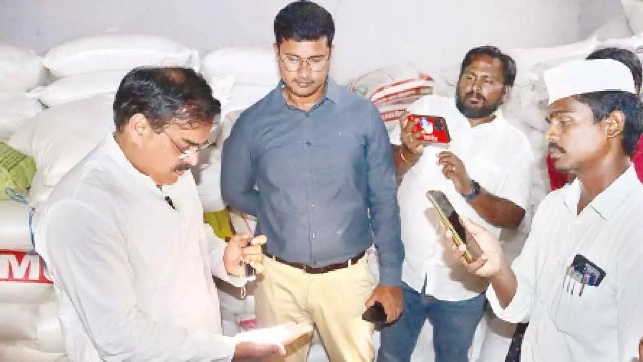 Minister for Civil Supplies Dr Nadendla Manohar inspecting stocks at a rice mill in Palandu district on Thursday