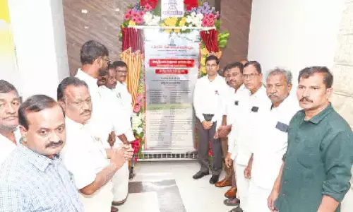 District Collector Dr S Venkateswara Rao, APSPDCL CMD K Santosh Rao and others taking part in unveiling the foundation stone laying plaque for Thukivakam substation on Thursday