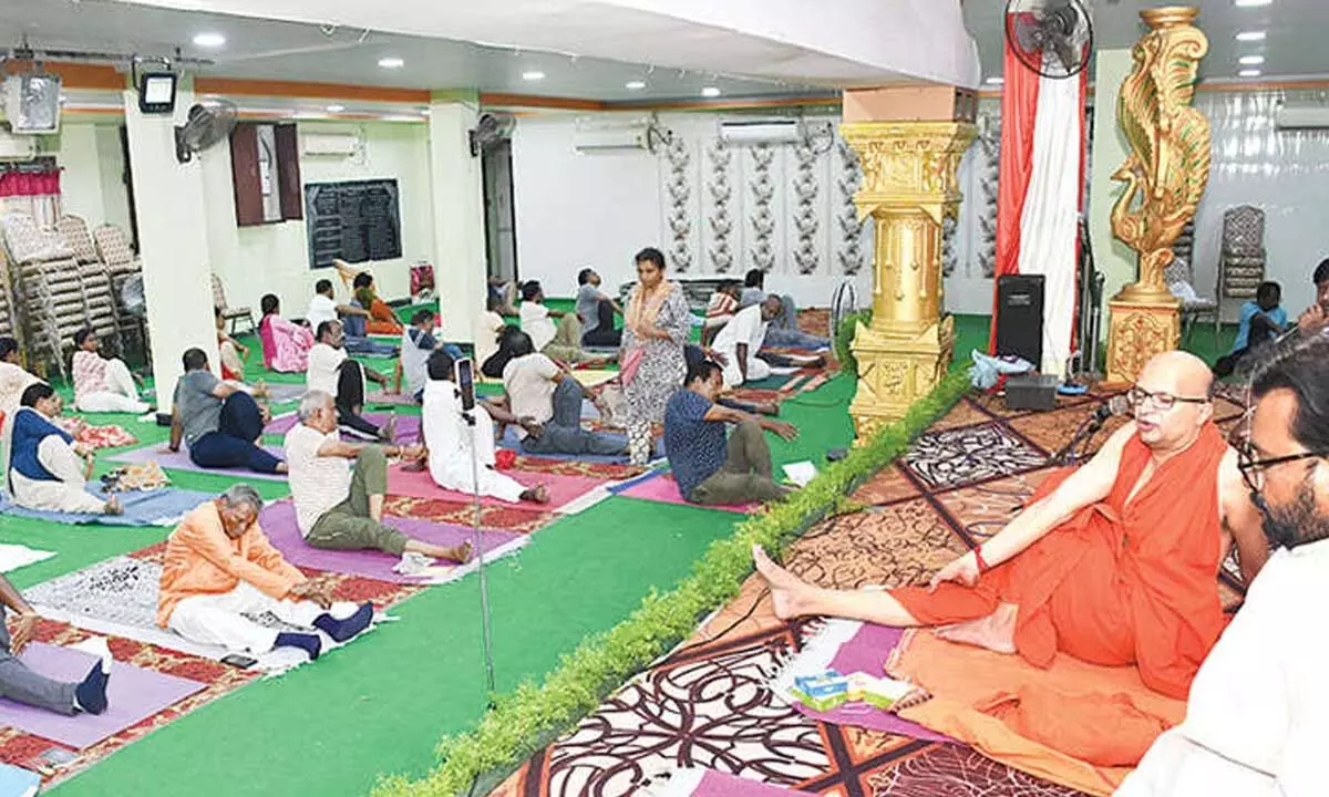 Swami Rith Dev conducting a Yogasana session in Ongole on Friday