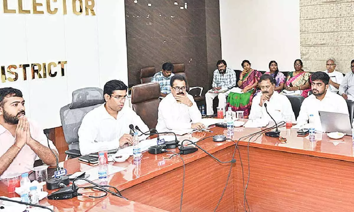 District Collector Dr S Venkateswar speaking at a meeting of revenue officials in Tirupati on Friday. Joint Collector Shubham Bansal, DRO Narasimhulu and others are also seen.