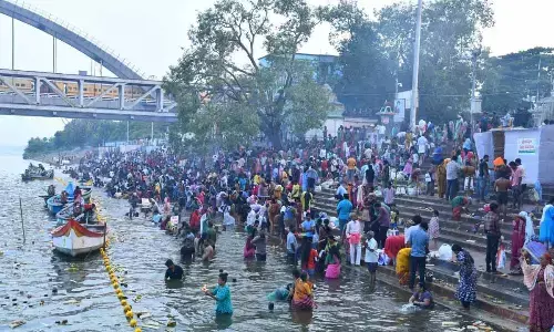 Devotes lighting traditional lamps on the occasion of Karthika Pournami at Pushkara Ghat in Rajamahendravaram on Friday