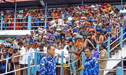 Pilgrims throng Sabarimala temple on opening day of long festive season