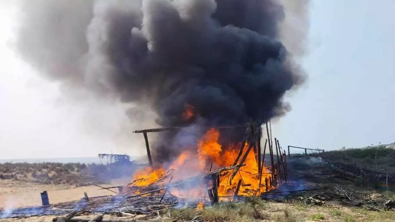 Fishing gear, sheds gutted on seashore