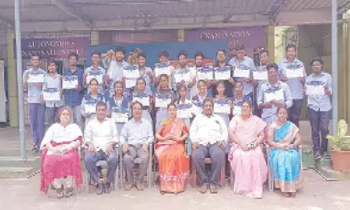 Principal Dr K Bhagya Lakshmi, Lecturers Dr PV Radhika and Sucharitha with the prize-winning team of B Com first students at SRR and CVR Government degree college in Vijayawada on Tuesday