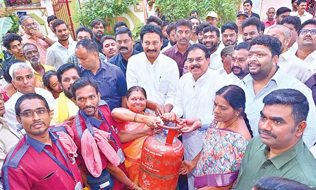 Minister for Civil Supplies Nadendla Manohar and MLA Gadde Rammohan participating in the free gas cylinders distribution programme in Vijayawada on Friday