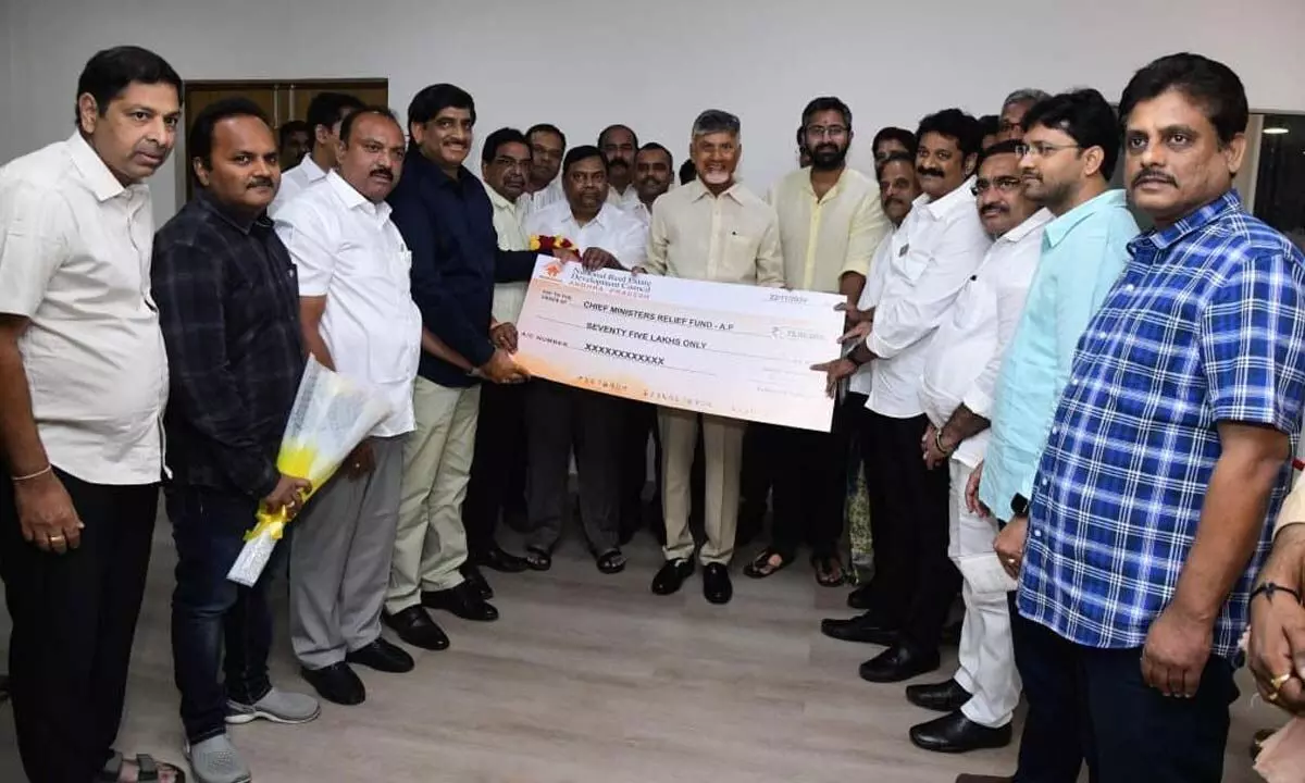 Representatives of the State unit of NAREDCO presenting a cheque for Rs 75 lakh to Chief Minister N Chandrababu Naidu at his residence in Undavalli on Friday