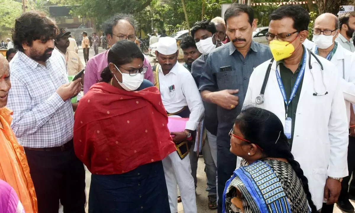 Collector K Vetri Selvi interacting with patients during an inspection of the GGH in Eluru on Friday