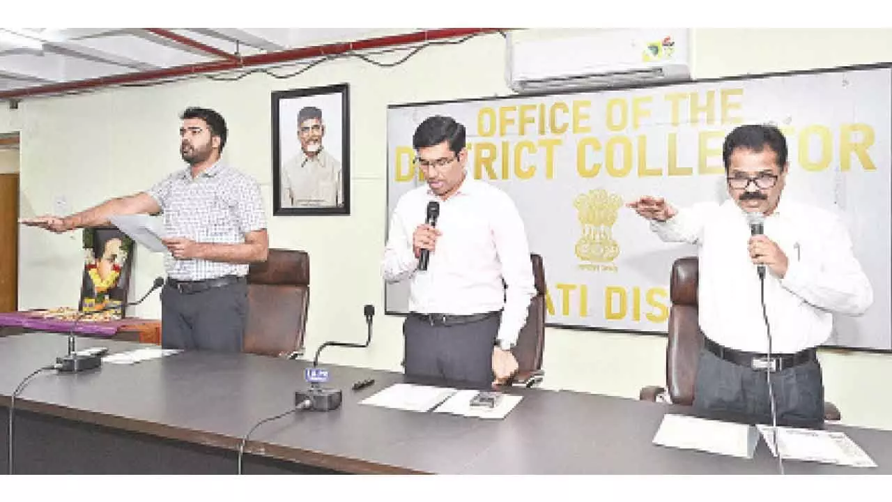 District Collector S Venkateswar administering the oath on the occasion of the Constitution Day in Tirupati on Tuesday. Joint Collector Shubham Bansal and DRO Narasimhulu are seen.