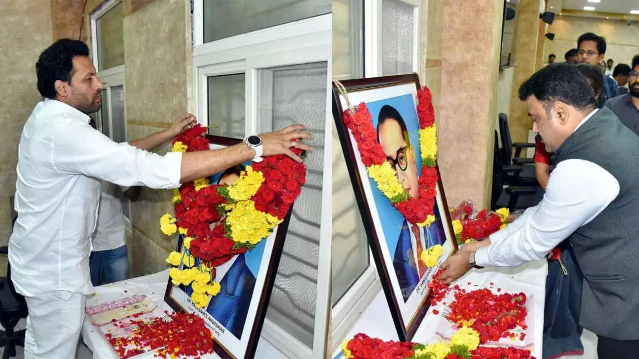 Minister of Industries, Commerce and Food Processing T G Bharath (left) and District Collector P Ranjith Basha paying floral tributes to the portrait of Dr BR Ambedkar on the occasion of the 75th Constitution Day in Kurnool on Tuesday