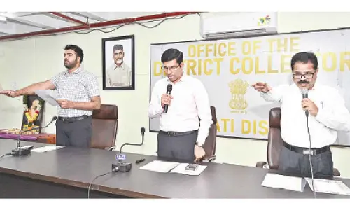 District Collector S Venkateswar administering the oath on the occasion of the Constitution Day in Tirupati on Tuesday. Joint Collector Shubham Bansal and DRO Narasimhulu are seen.