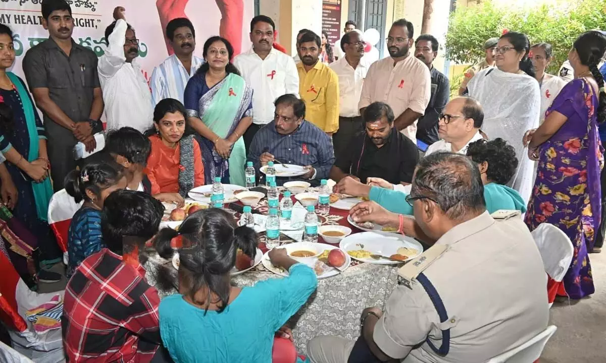 Collector P Prasanthi taking part in a community breakfast with HIV-affected children on Sunday