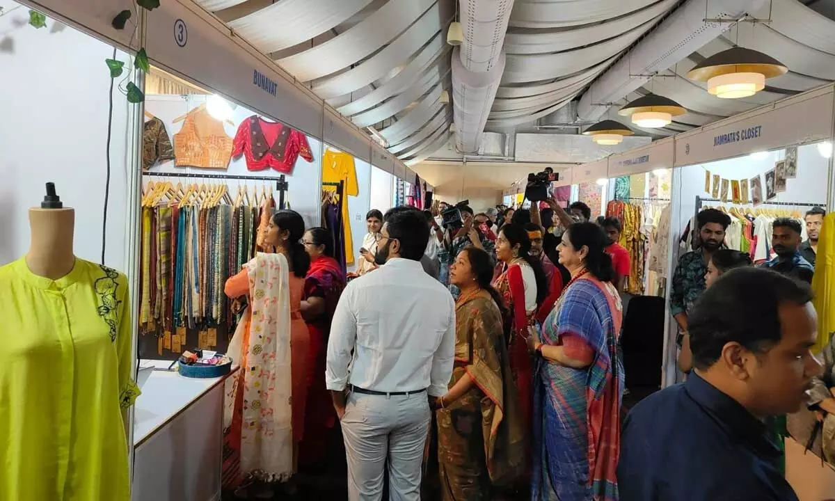 Assorted hand-woven saris, handicrafts on display