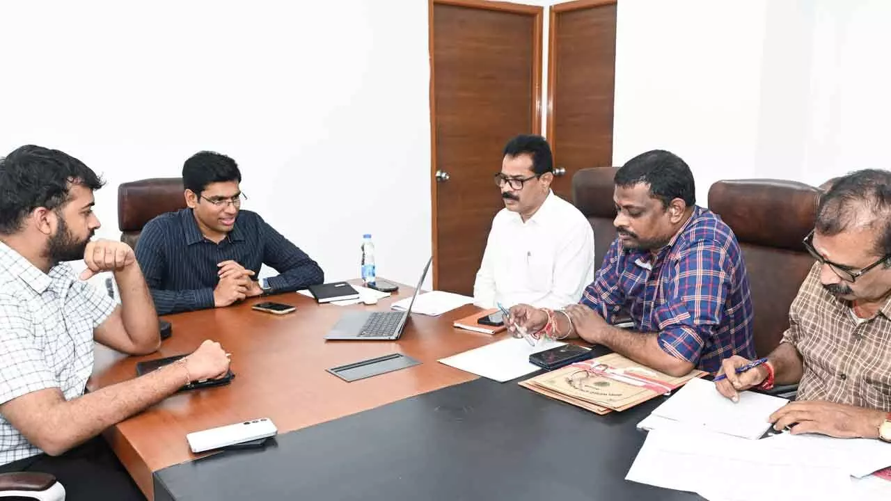 District Collector Dr S Venkateswar addressing a virtual meeting of NHAI and Revenue officials on Tuesday. Joint Collector Shubham Bansal, DRO Narasimhulu and others are also seen.