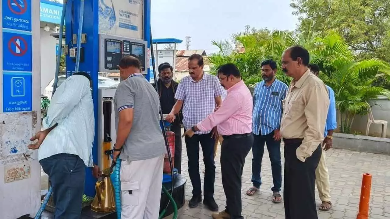 Vigilance and Enforcement officials checking a petrol bunk in Anantapur on Tuesday